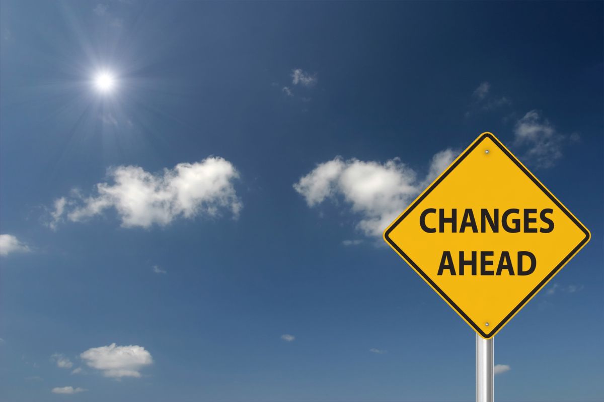 A Changes ahead sign on a yellow background against a blue sky